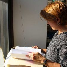 insurance archeologist looking through files