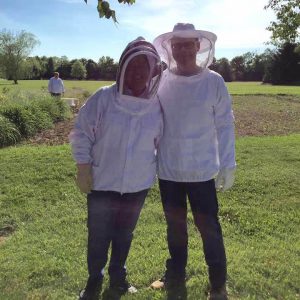 Senior Project Manager, Jennifer Hallgarth (Left), and Project Manager, Casey McFall (Right), use their free time to do some beekeeping.