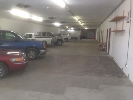 cars and trucks parked in building