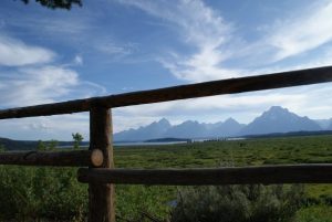 Picture of mountains in the Grand Teton National Park framed by a split rail fence