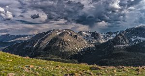 Picture of Rocky Mountains with dark clouds in the sky
