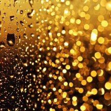 Water droplets on PFAS treated glass with warm glow backlight