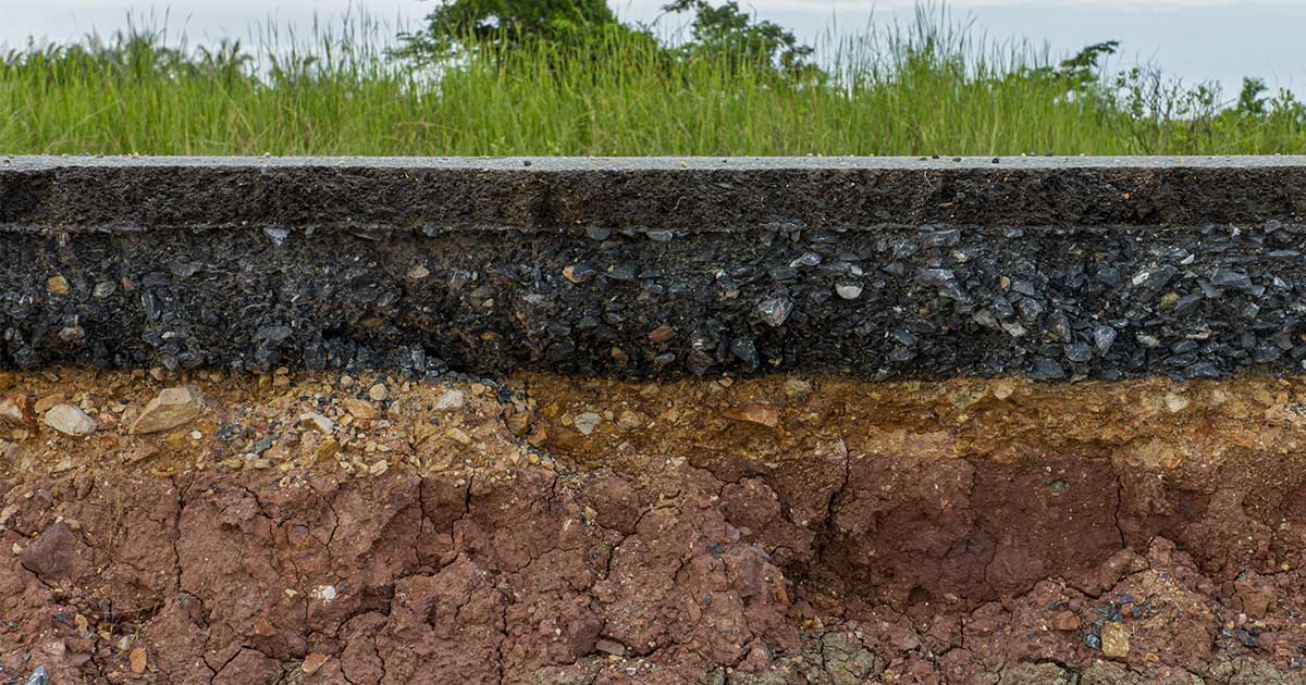 Cross-section look at the subsurface where PCE contamination can potentially transport through soil and into groundwater a great distance away from a drycleaning operation 