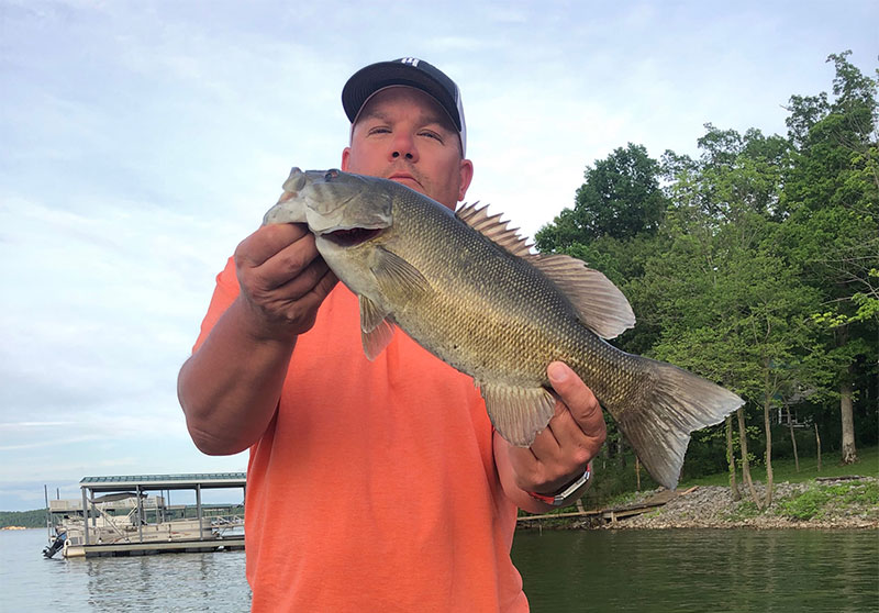 Brian Moskalick holding a fish he caught at Kentucky Lake