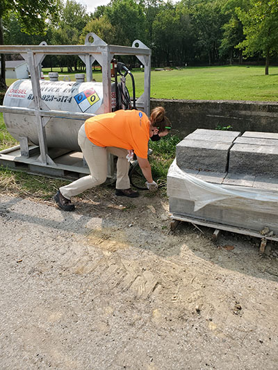 Grace picking up trash in Madison Indiana