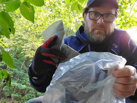 Rob picking up trash