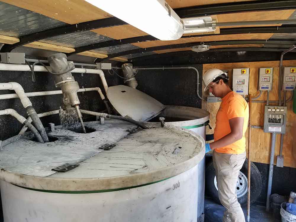 field professional overseeing mixing of remedial chemical